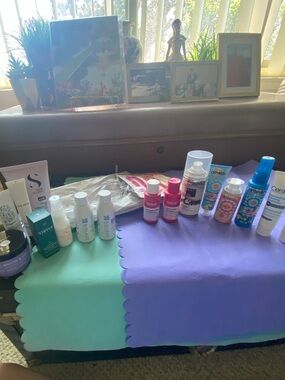 Assorted Beauty + Hair Care Bottle Lot in Pink, Blue, Purple With Silver bag